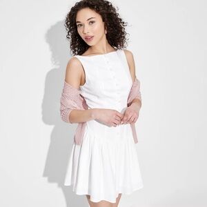 White drop-waist dress with buttons and low back